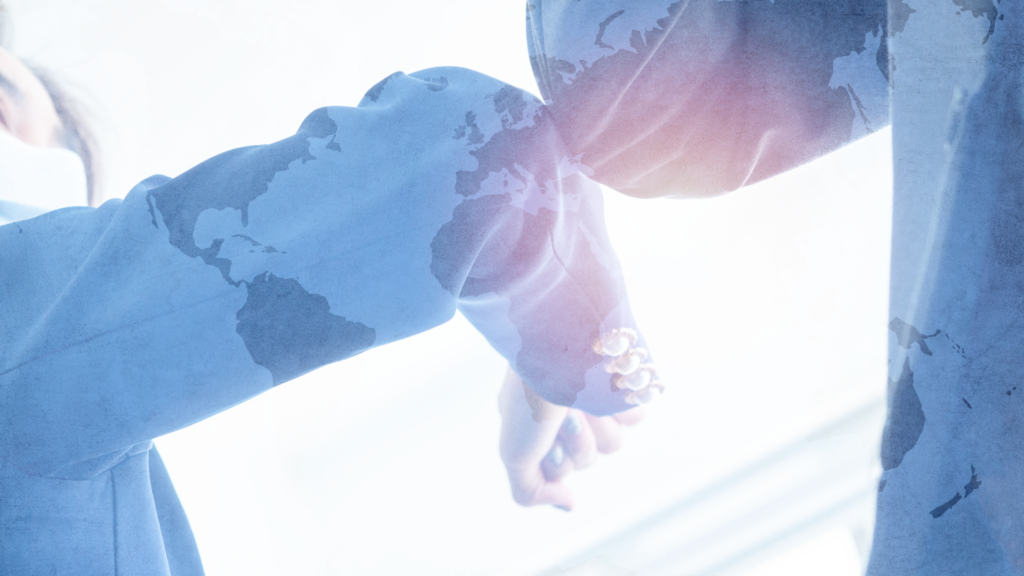Global connection through greeting. Each culture does it different, image depicting two people greeting each other through an elbow bump, wearing world map clothing.